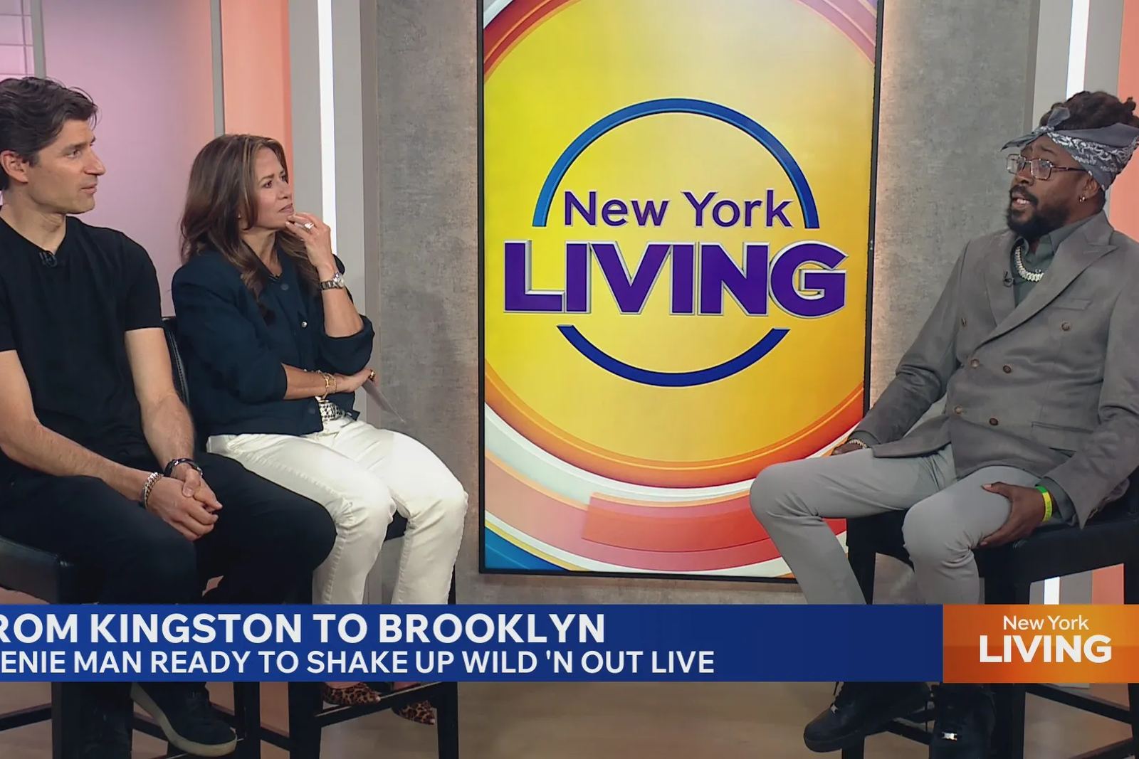 Beenie Man in studio with two hosts on the New York Living set, the lower-third reading From Kingston to Brooklyn